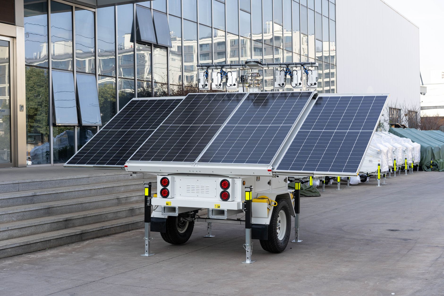 a portable generator and a portable power station sitting near a home during an outage